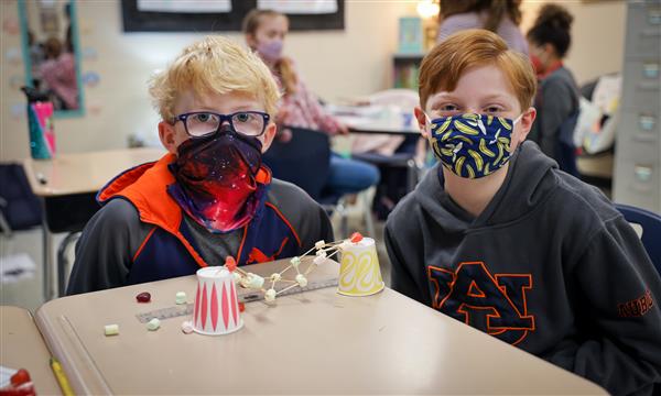 students work to build a bridge